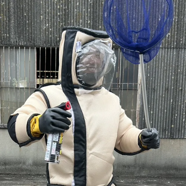 専用防護服を着用した現場スタッフの瀧本